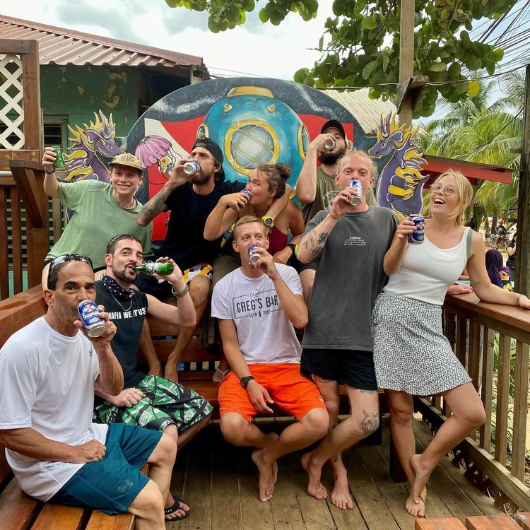 Divemaster trainees enjoying a drink at the end of the day, Roatan
