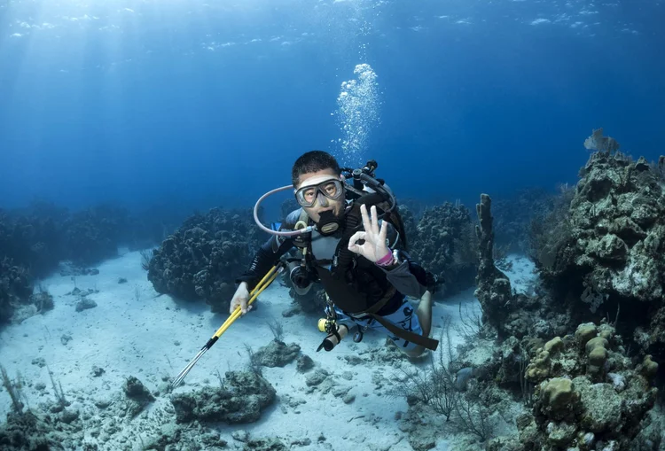 PADI Divemaster in action at the dive shop