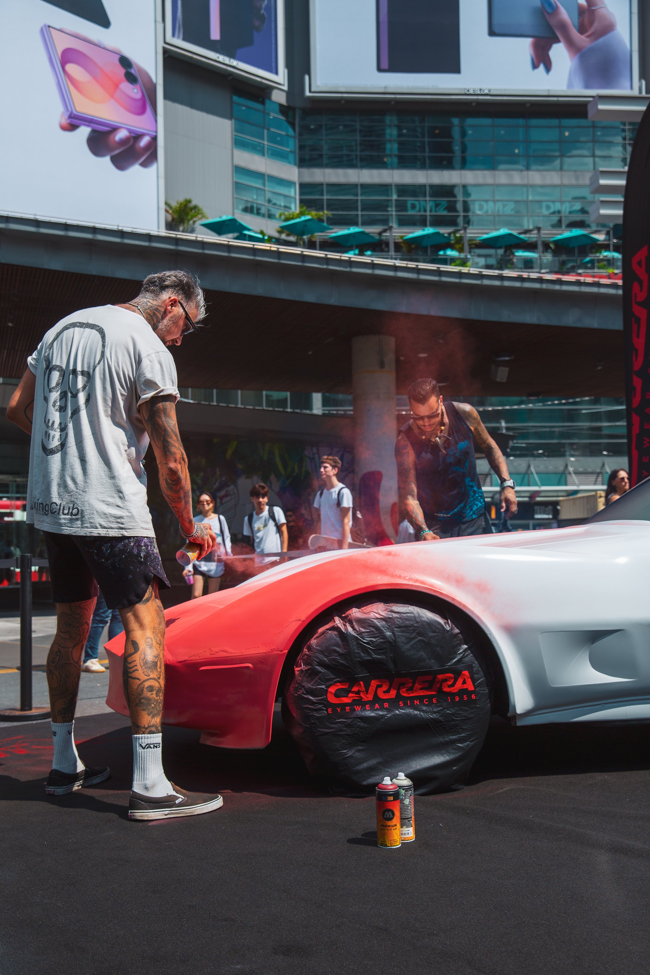 Live painting for Carrera in a Toronto square, with the branded car and spectators