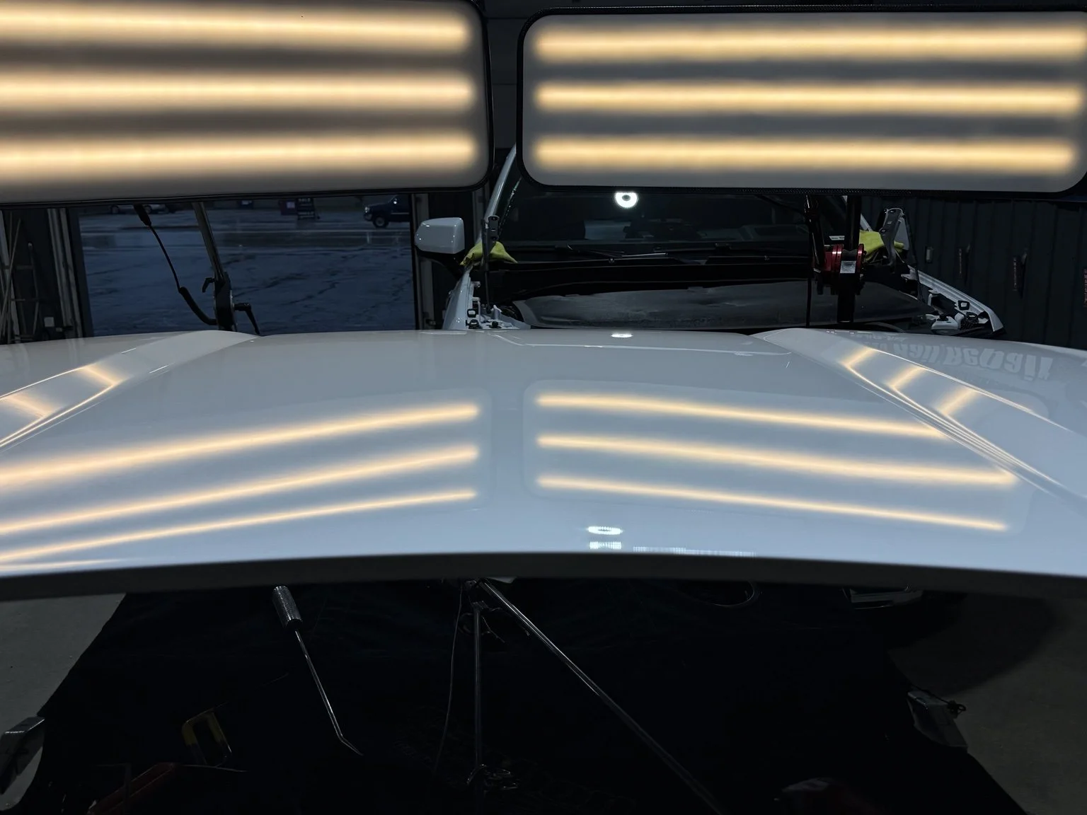 Vehicle hood restored after Paintless Dent Repair