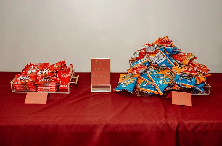 A pile of Kit-Kats and a pile of Cheetos
