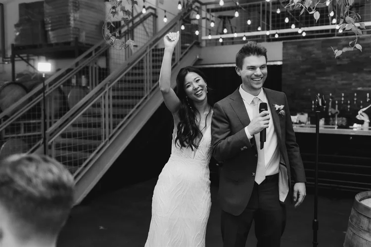 A couple celebrates at their wedding.