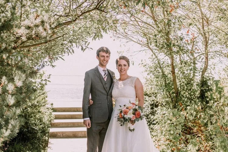 A bride and groom on their wedding day.