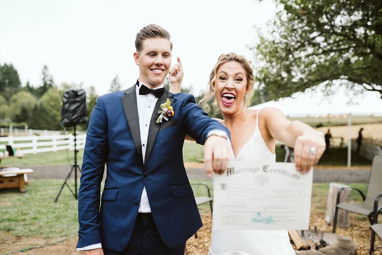 A bride and groom celebrate on their wedding day.