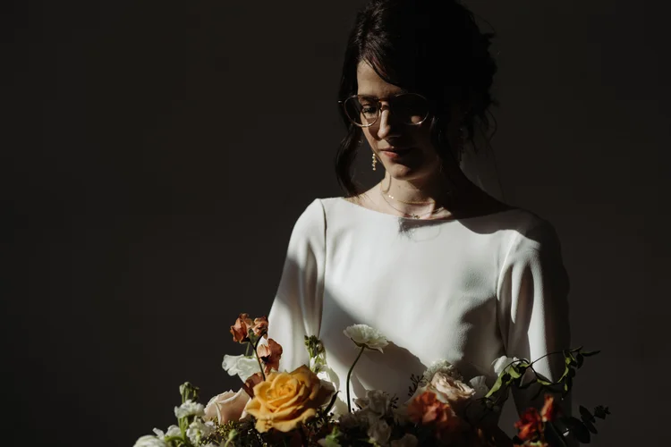 A bride holds her bouquet.