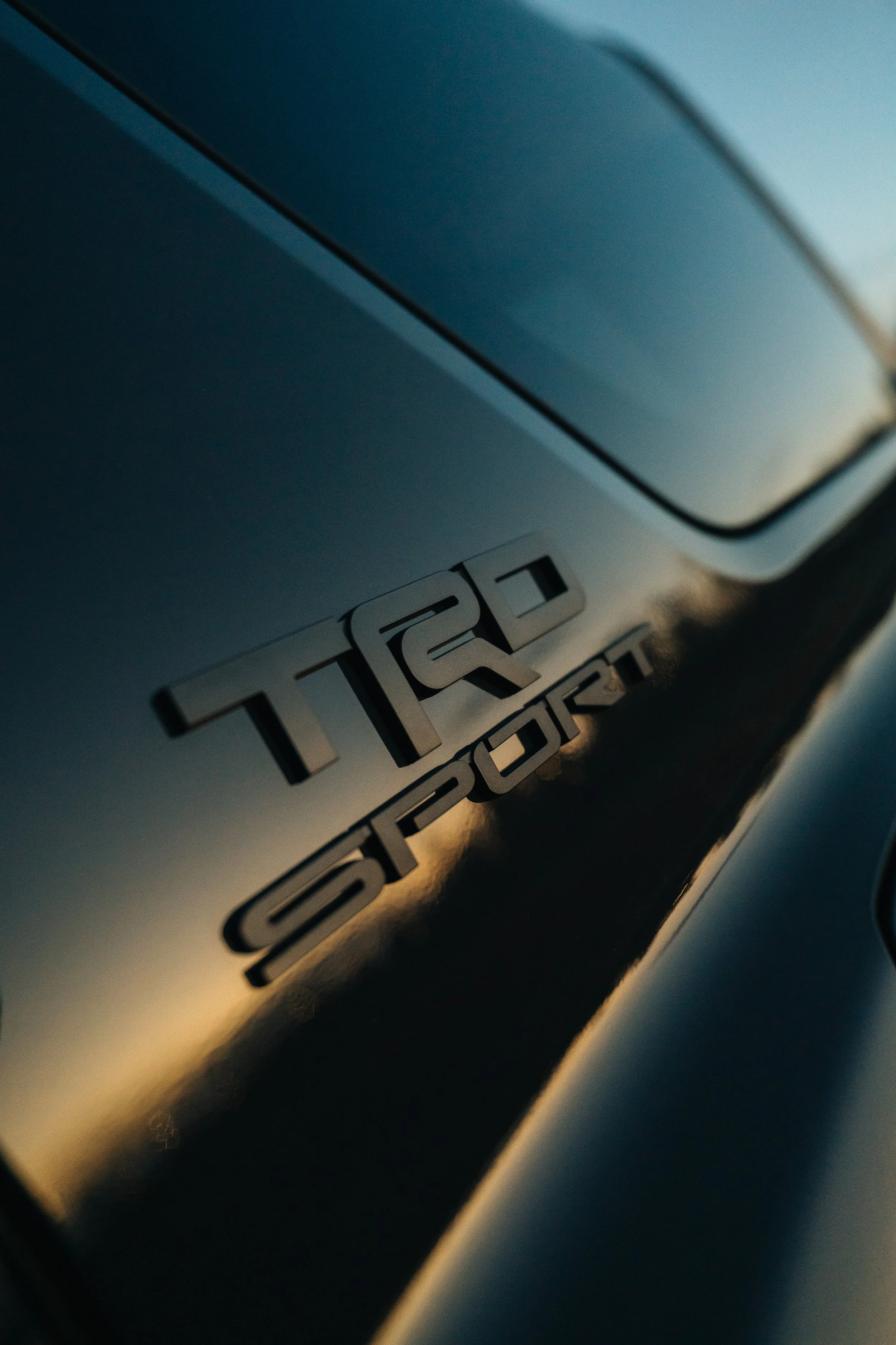 Front exterior detail of Ian Jones' 2025 Toyota 4Runner TRD Sport build, showing body lines, grille area, OEM+ styling direction, and professional 6th gen 4Runner build photography for ISJDesigns.