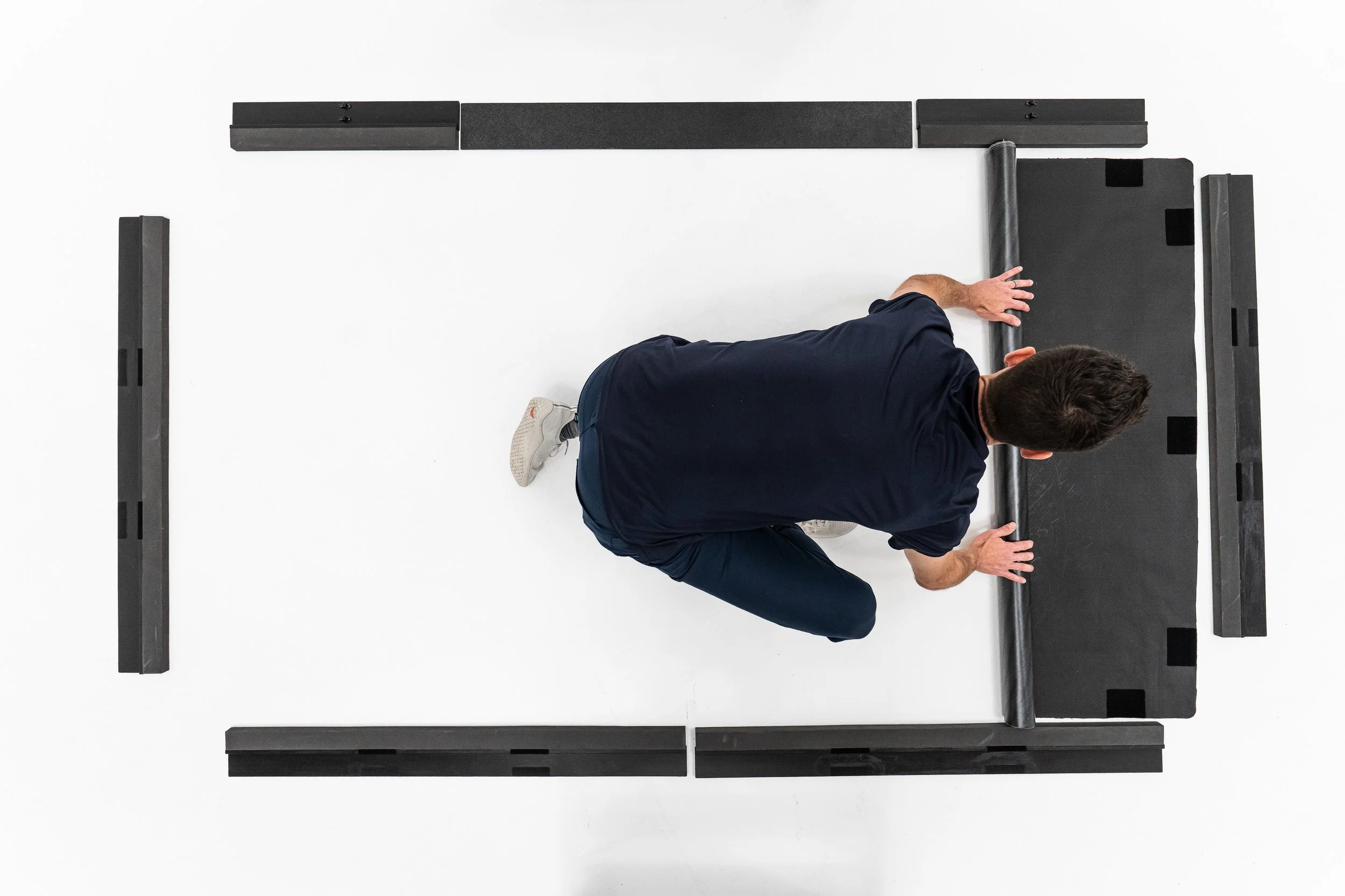 Pittsburgh studio product photography by Ian Jones of ISJDesigns showing a hockey training mat installation for a commercial product campaign.