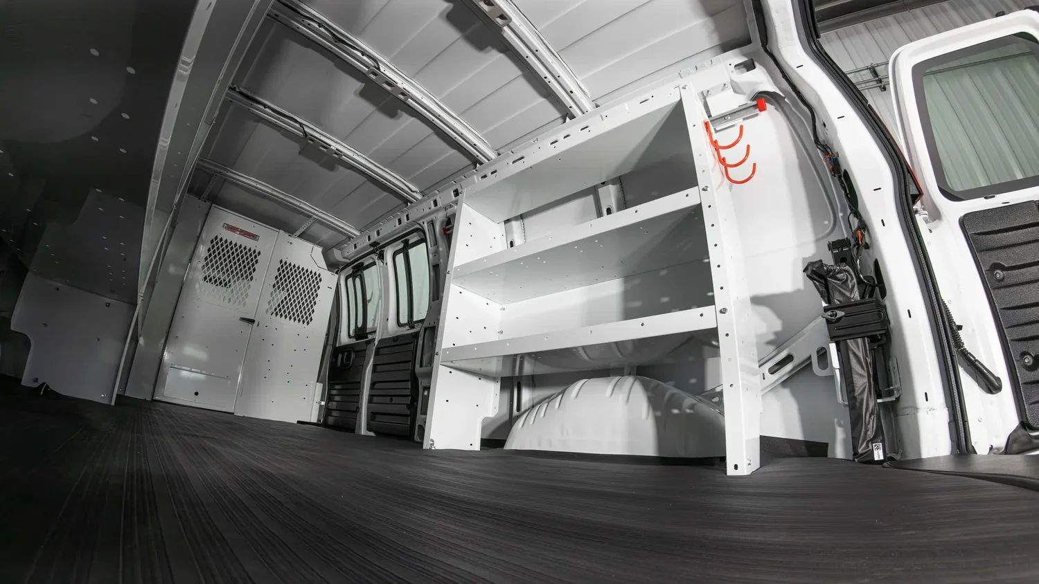Van shelving interior proving installed fit and usable storage for accessory brands. Ian Jones, ISJDESIGNS.