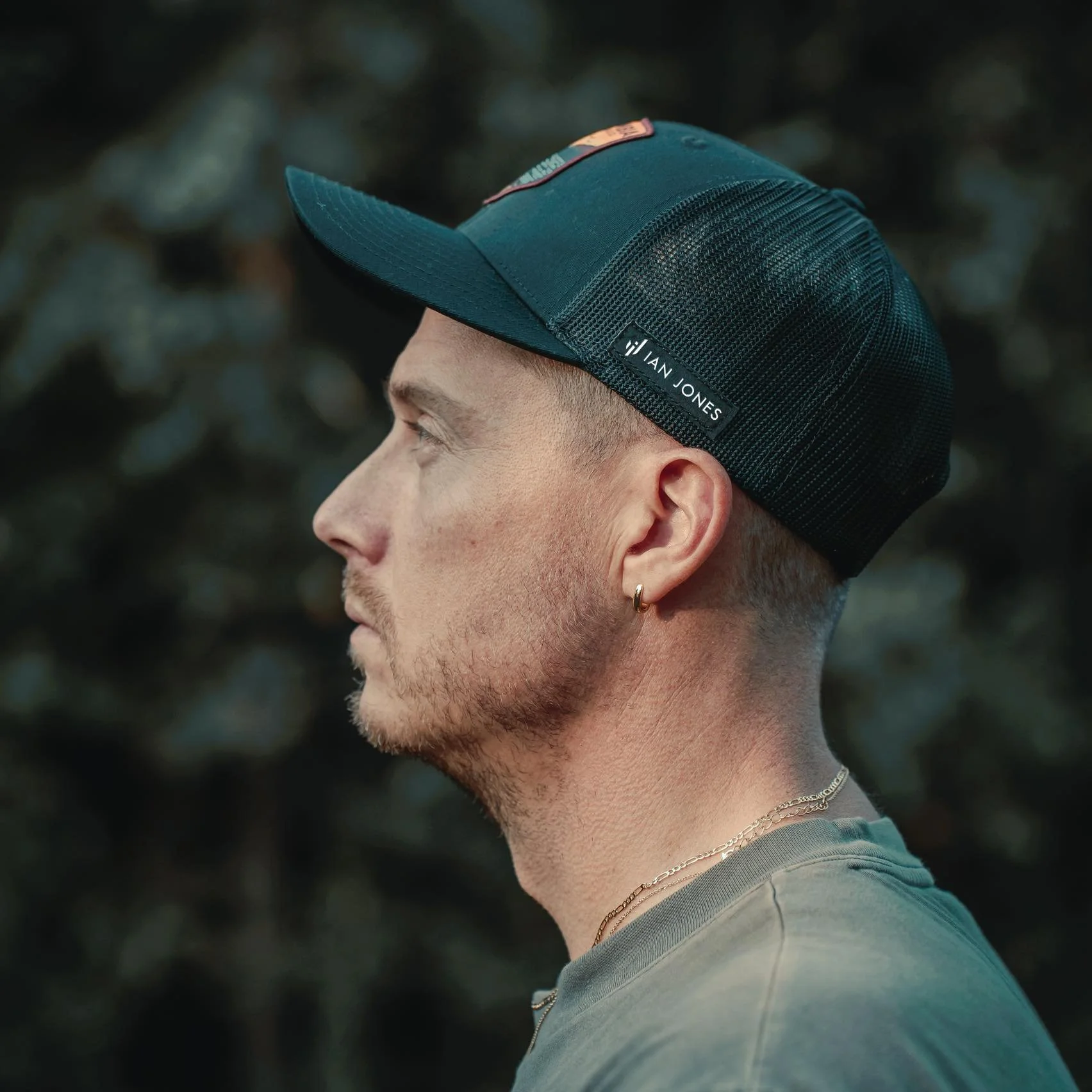Side-profile portrait of Pittsburgh commercial photographer Ian Jones featured in his Tamron Americas photographer profile.