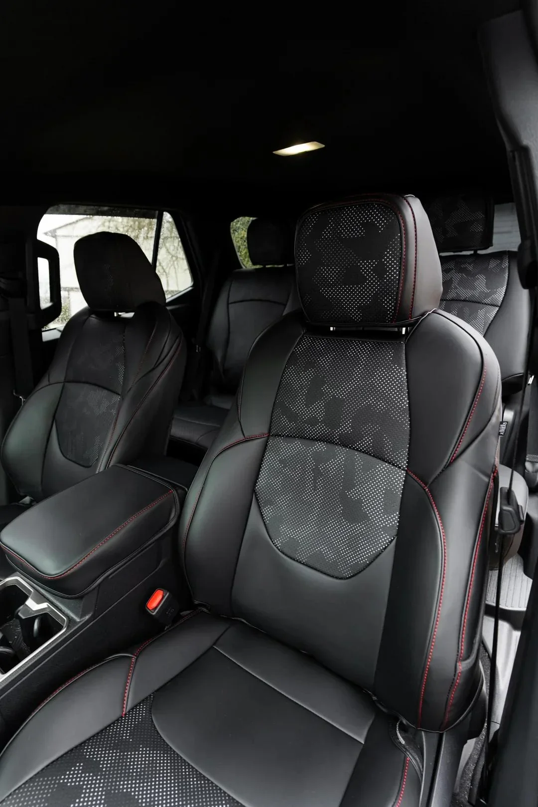 Nappa Leather Full Coverage Camo seat covers installed in Ian Jones' 2025 Toyota 4Runner TRD Sport interior, showing 2025 4Runner seat covers, interior accessories, and daily-driver protection.