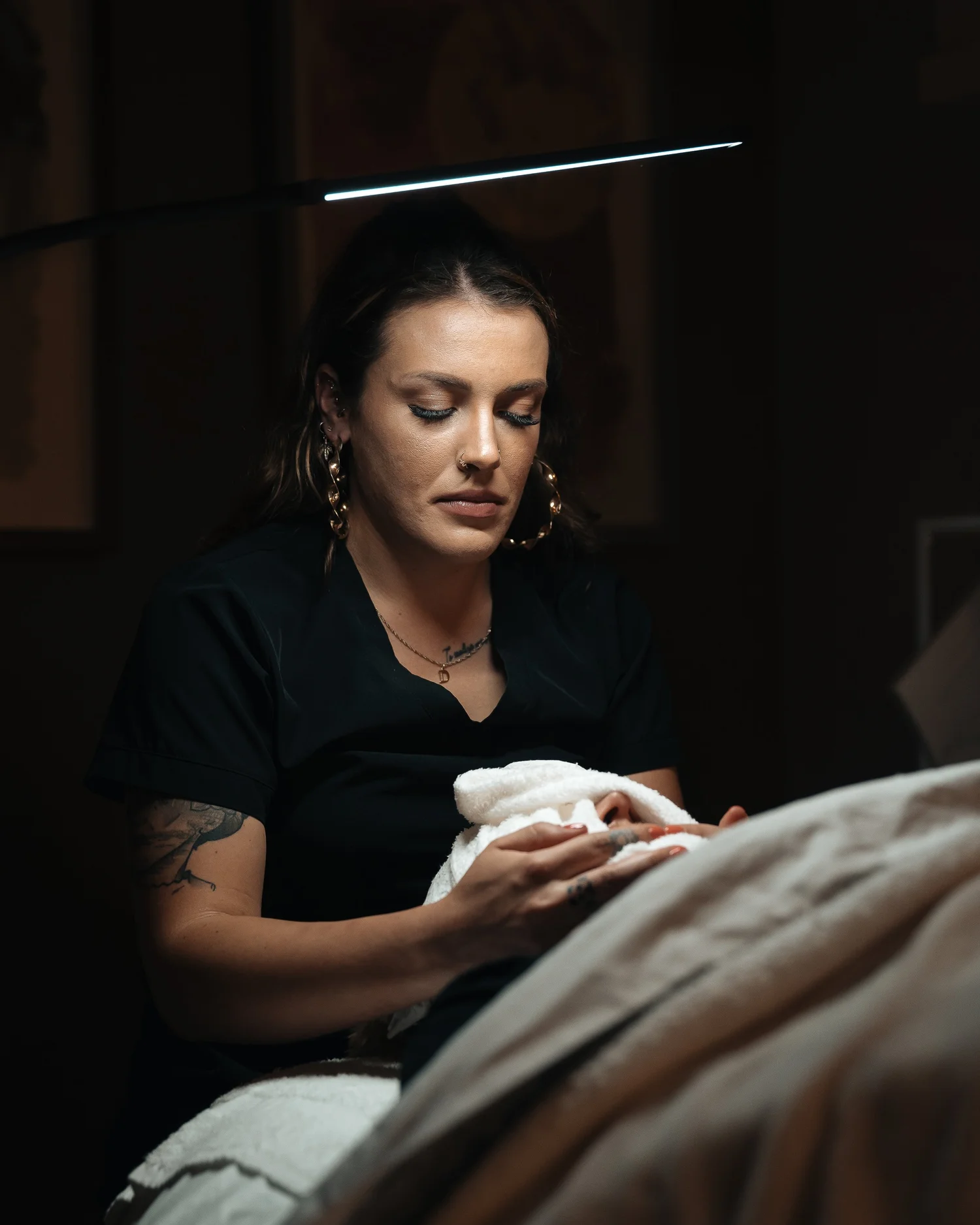 Pittsburgh esthetician during a client treatment session, skincare photography by Ian Jones