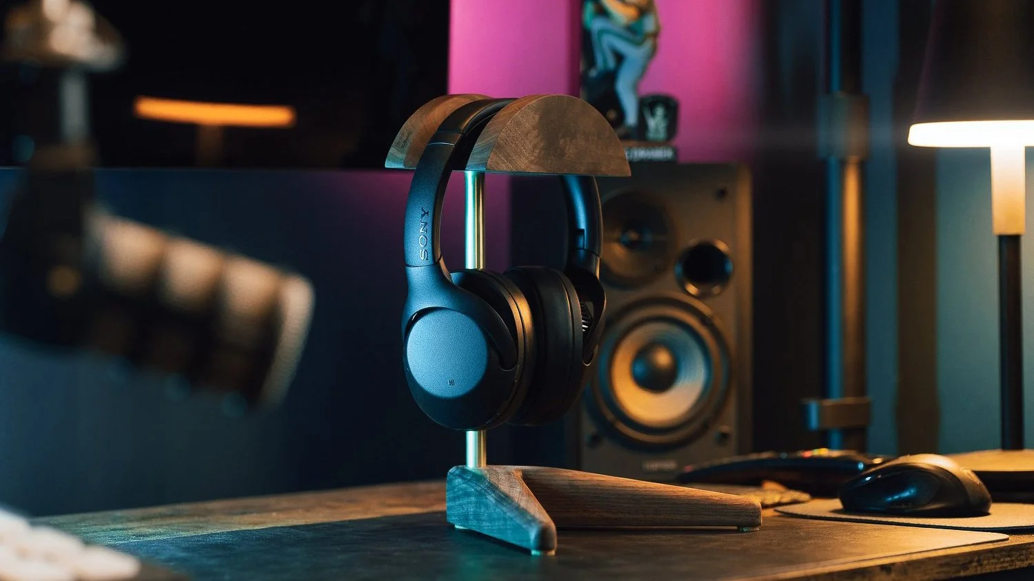 Pittsburgh product photography by Ian Jones of ISJDesigns showing Sony headphones on a wooden stand in a cinematic desktop setup.