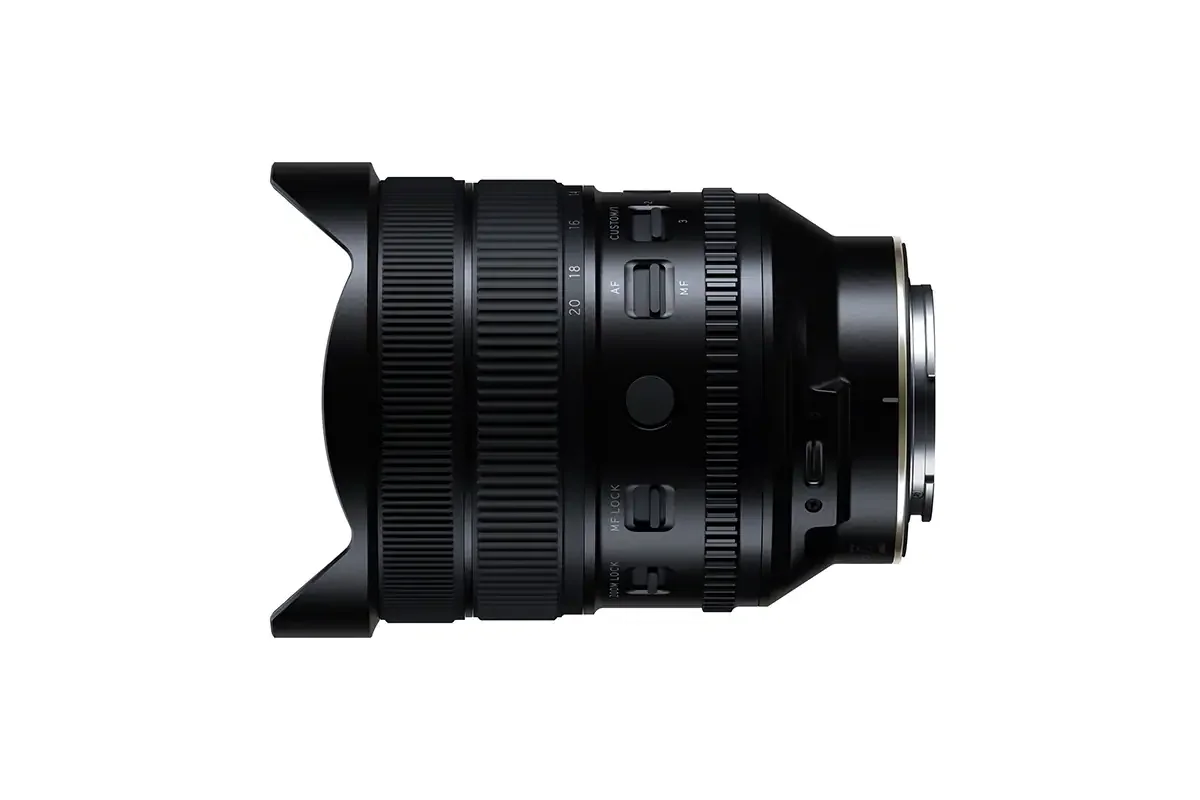 Side profile of the Tamron 12-20mm F2.8 showing its built-in petal hood, zoom scale, AF/MF and MF LOCK switches and the USB-C port near the mount