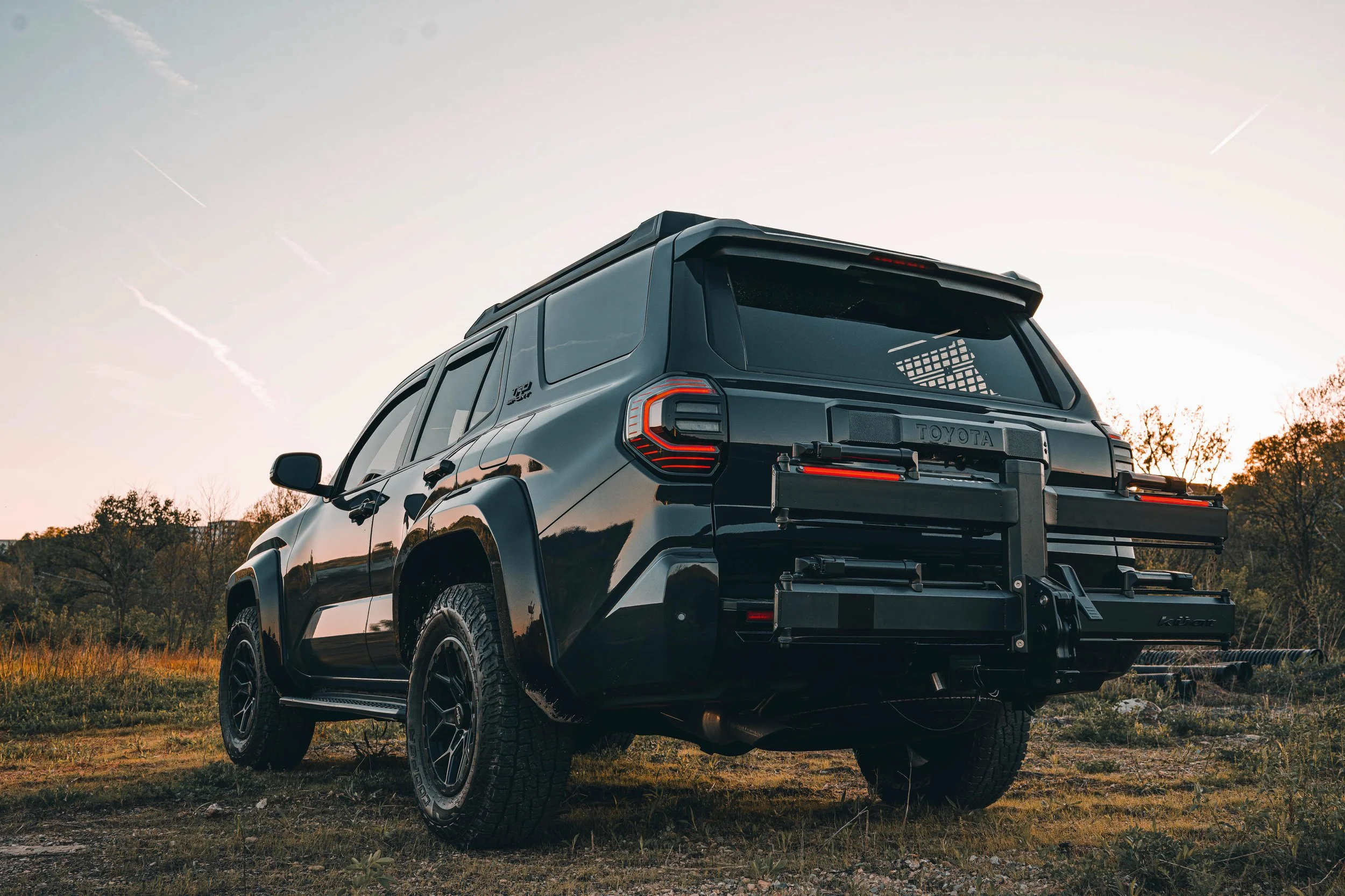Kuat Piston Pro X hitch-mounted bike rack installed on Ian Jones' 2025 Toyota 4Runner TRD Sport build, photographed for the ISJDesigns long-term review after two months of real-world use across mountain bike rides, dirt back roads, and a road trip to upstate New York.