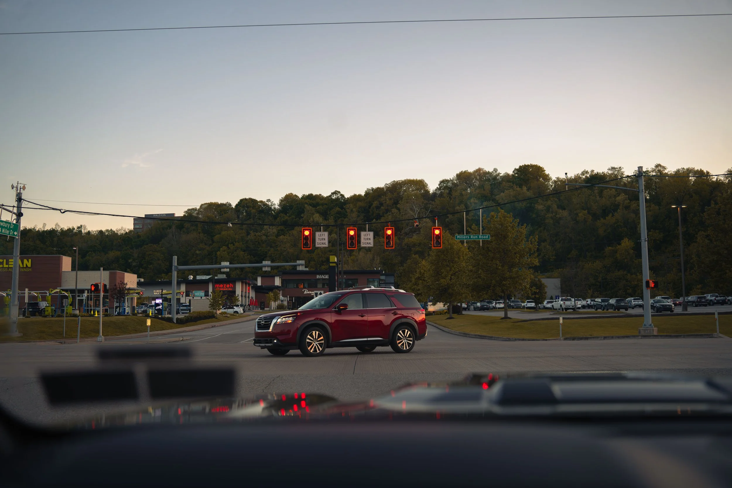 Evening traffic scene photographed from inside a vehicle by Ian Jones of ISJDESIGNS, showing real-world autofocus and everyday shooting conditions with the Tamron 35-100mm.