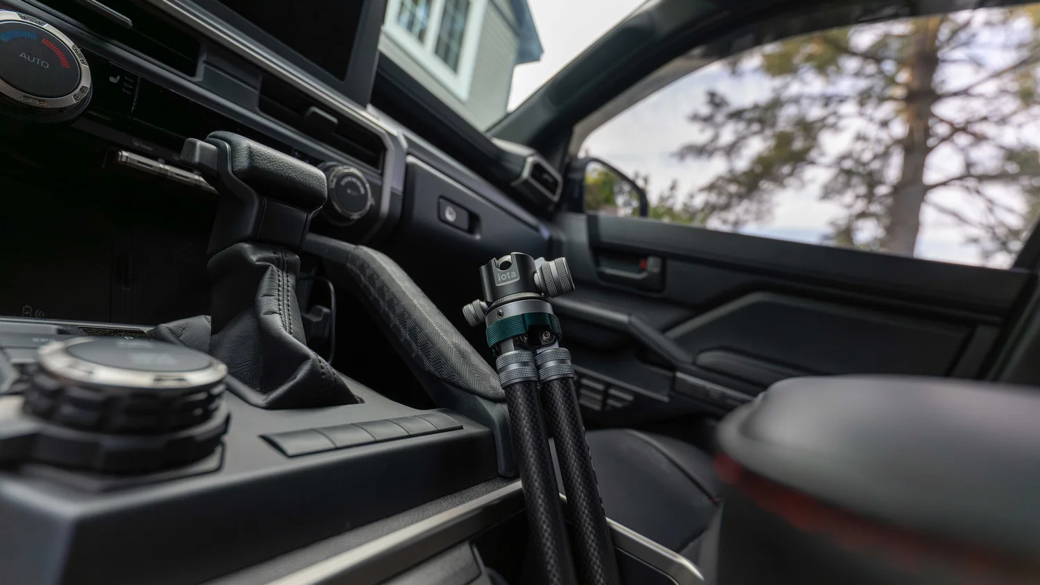 ProMaster iota 219 tripod folded and stowed against the center console of a Toyota 4Runner