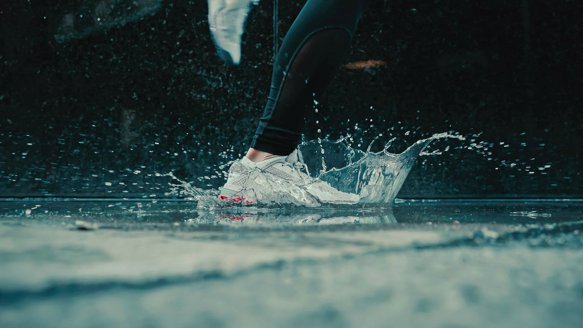 Action product photography in Pittsburgh by Ian Jones of ISJDesigns showing a sneaker splashing through water for a dynamic lifestyle campaign.