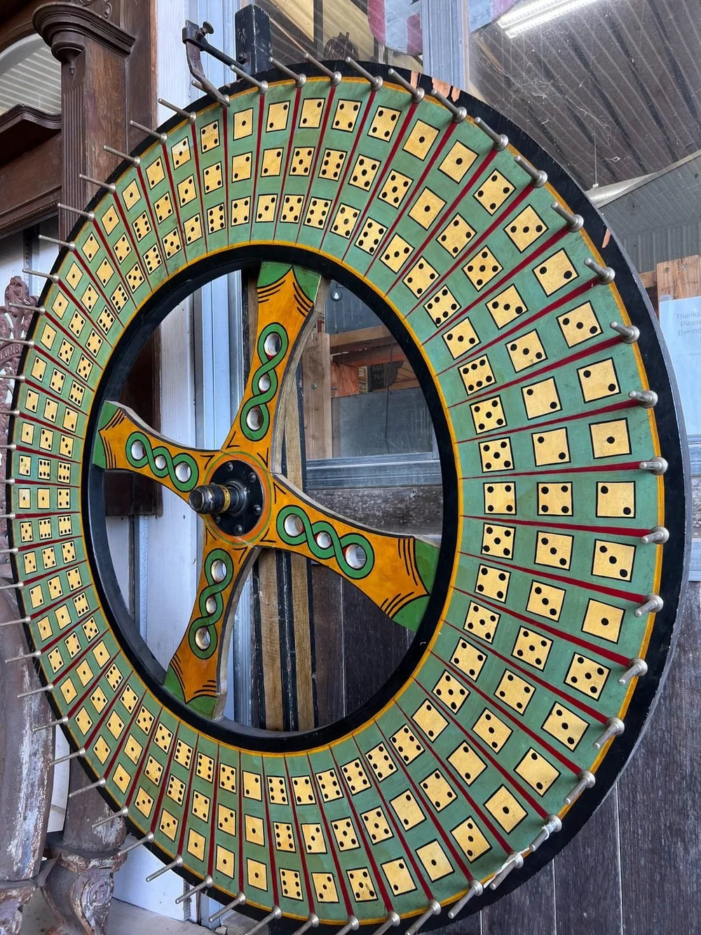 Hand-painted antique carnival game wheel with dice pattern
