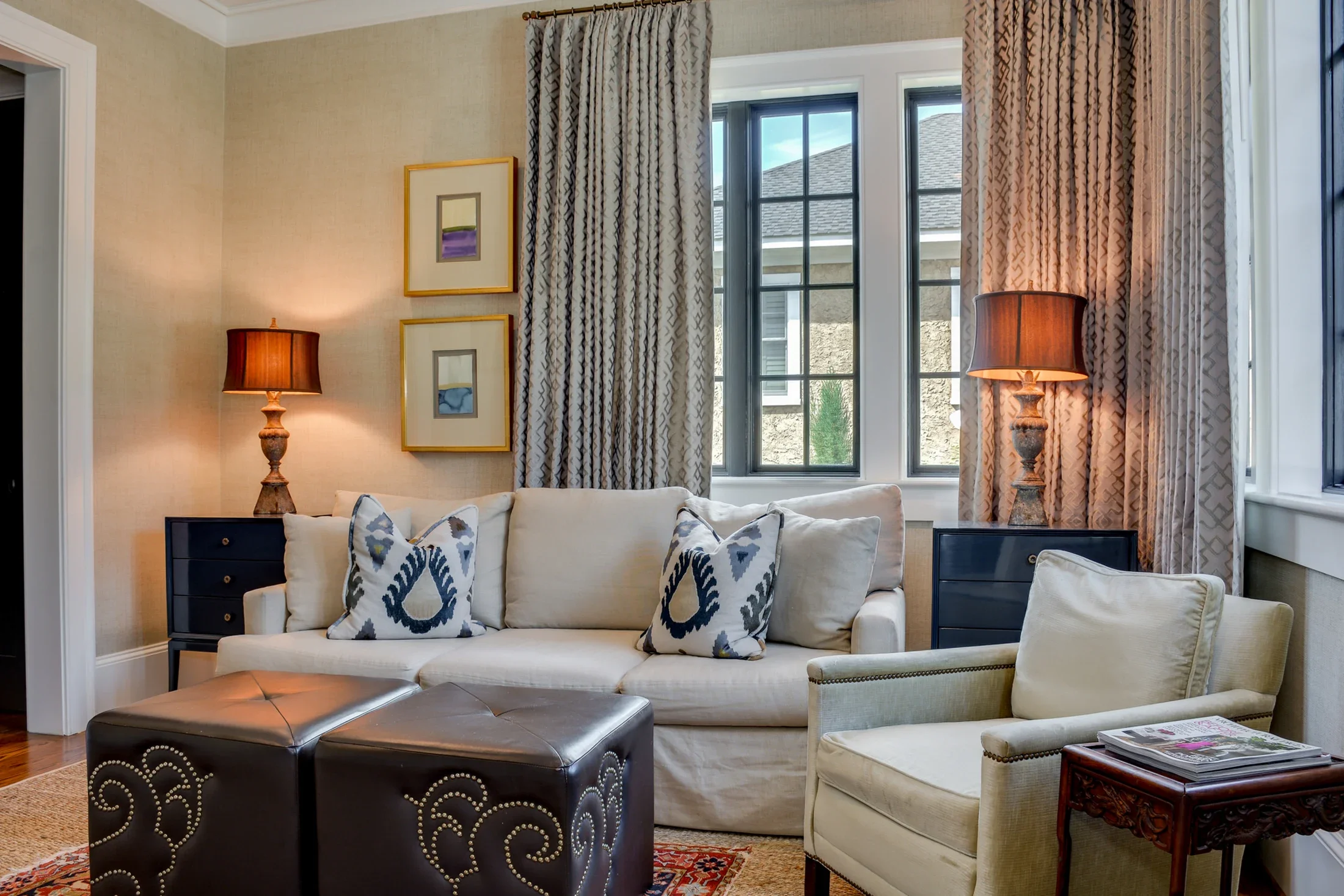 An inviting sitting room with soft upholstery and warm lamplight