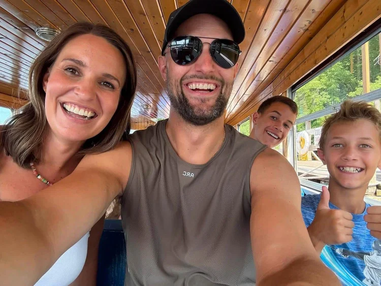 Cory and Amanda Smallegan with their family on a boat