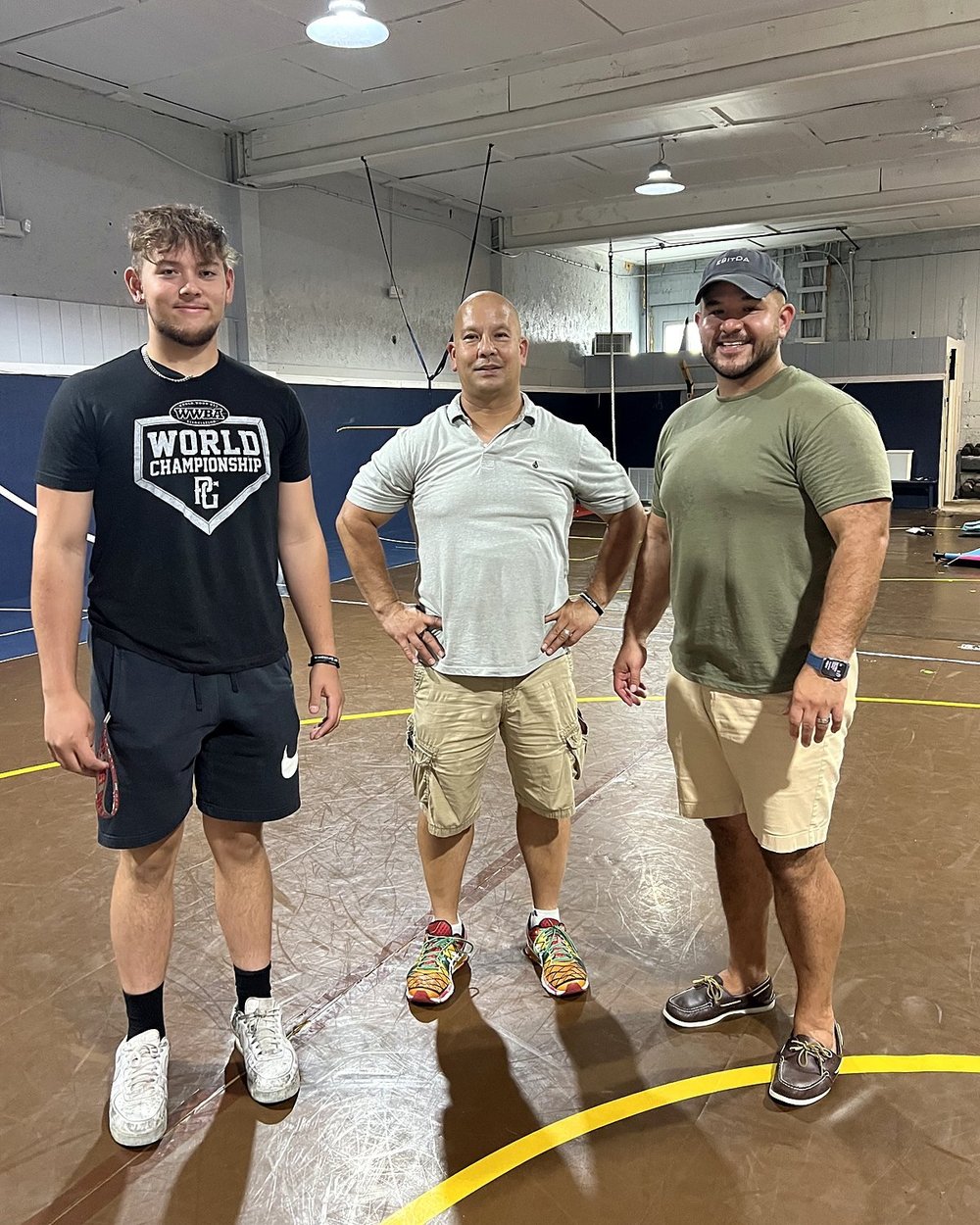 Chase Slepak with his dad and brother at Swing Zone Sports Hub