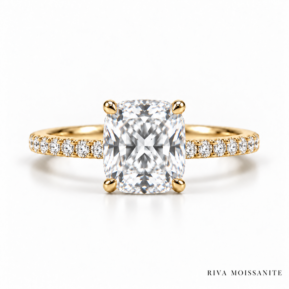 Cushion cut engagement ring with pavé band in yellow gold