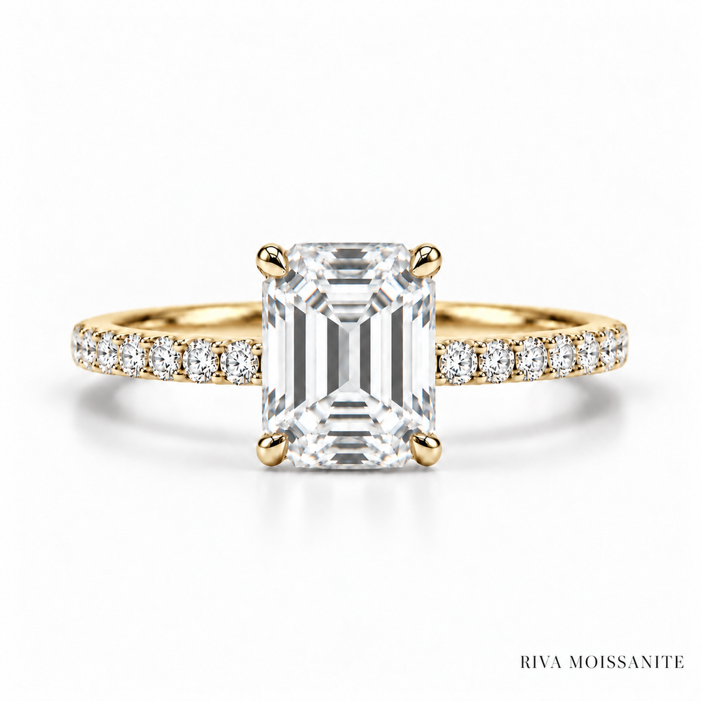 Emerald cut engagement ring with pavé band in yellow gold