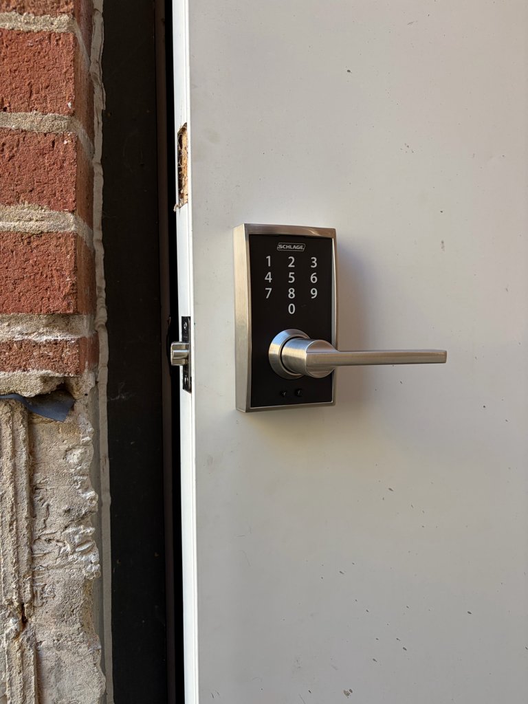 Schlage keypad deadbolt being installed on a Chicago home front door