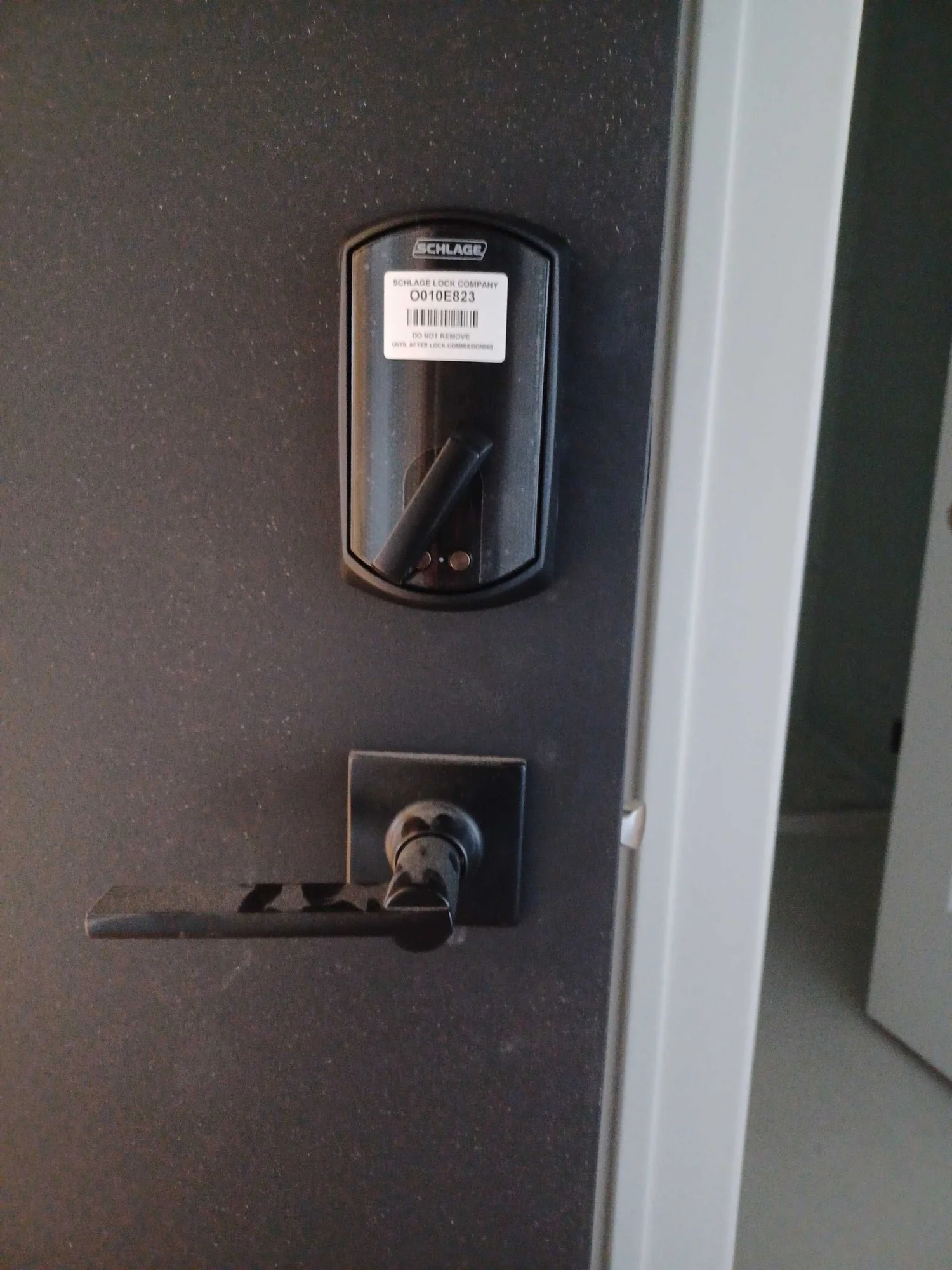 Schlage electronic lock being installed on a Chicago commercial door