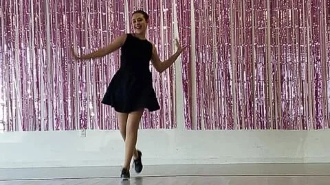 Tap dancer in black dress