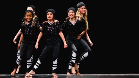 Hip-hop dance group in black outfits