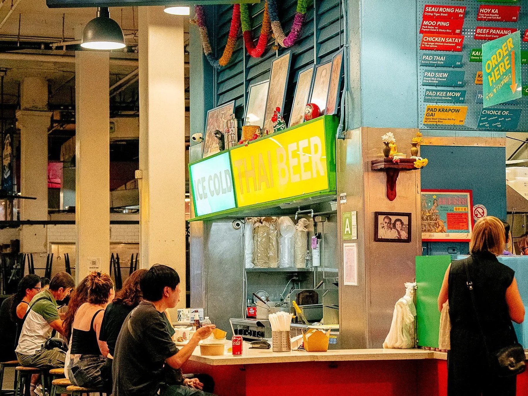 The Sticky Rice stall and neon sign at Grand Central Market in Downtown LA