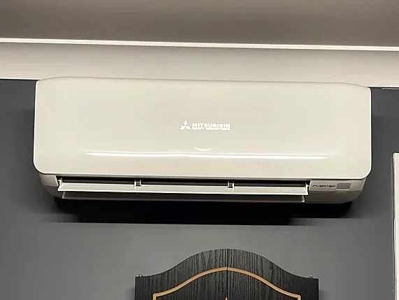 Mitsubishi Heavy Industries split system installed on a dark feature wall