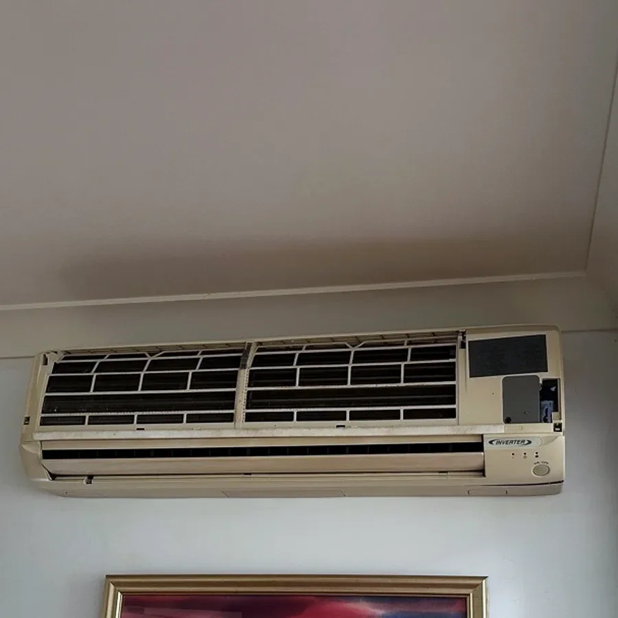Old indoor air conditioning unit before replacement