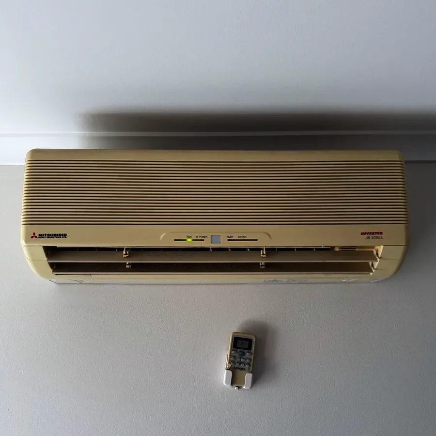 Yellowed old air conditioner before replacement