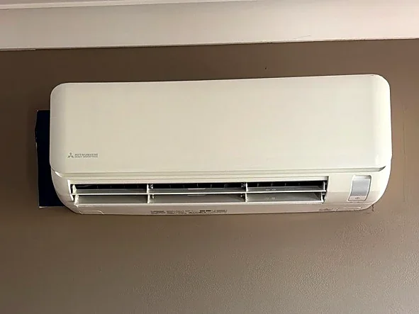 Split system installed on a warm taupe feature wall