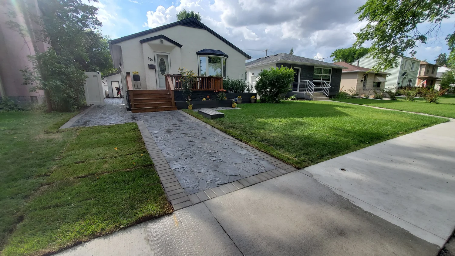 Custom flagstone paving stone walkway and driveway extension on Oxford Street River Heights