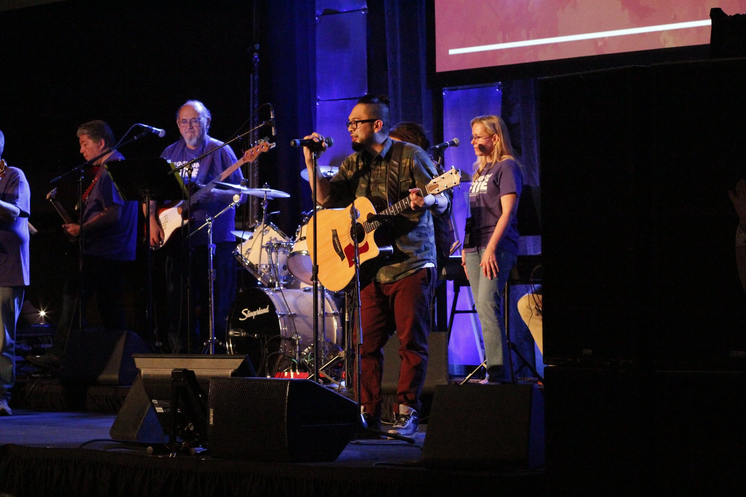 Aires Patulot playing guitar during ministry