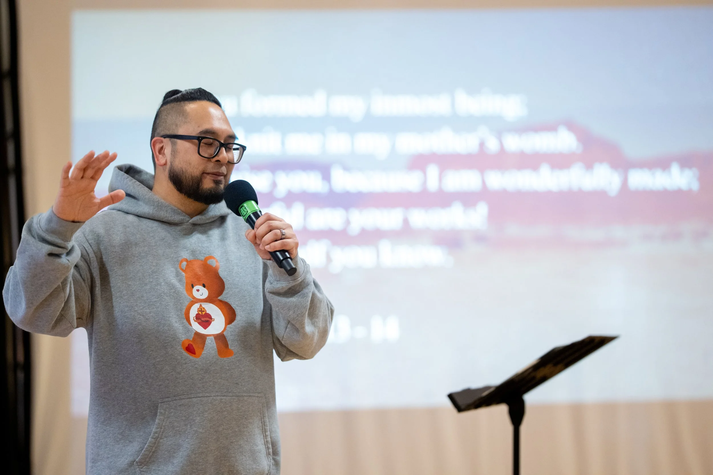 Aires Patulot in prayer before ministry