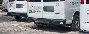 Schlitt Electrical Contracting service vans with the S.E.C. logo and phone number