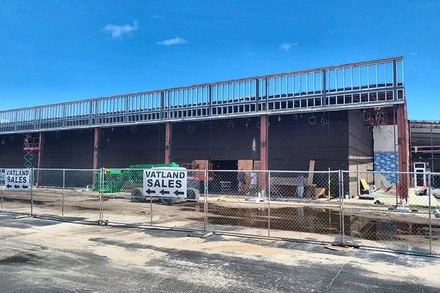 Car dealership building under construction, with electrical work by Schlitt Electrical Contracting