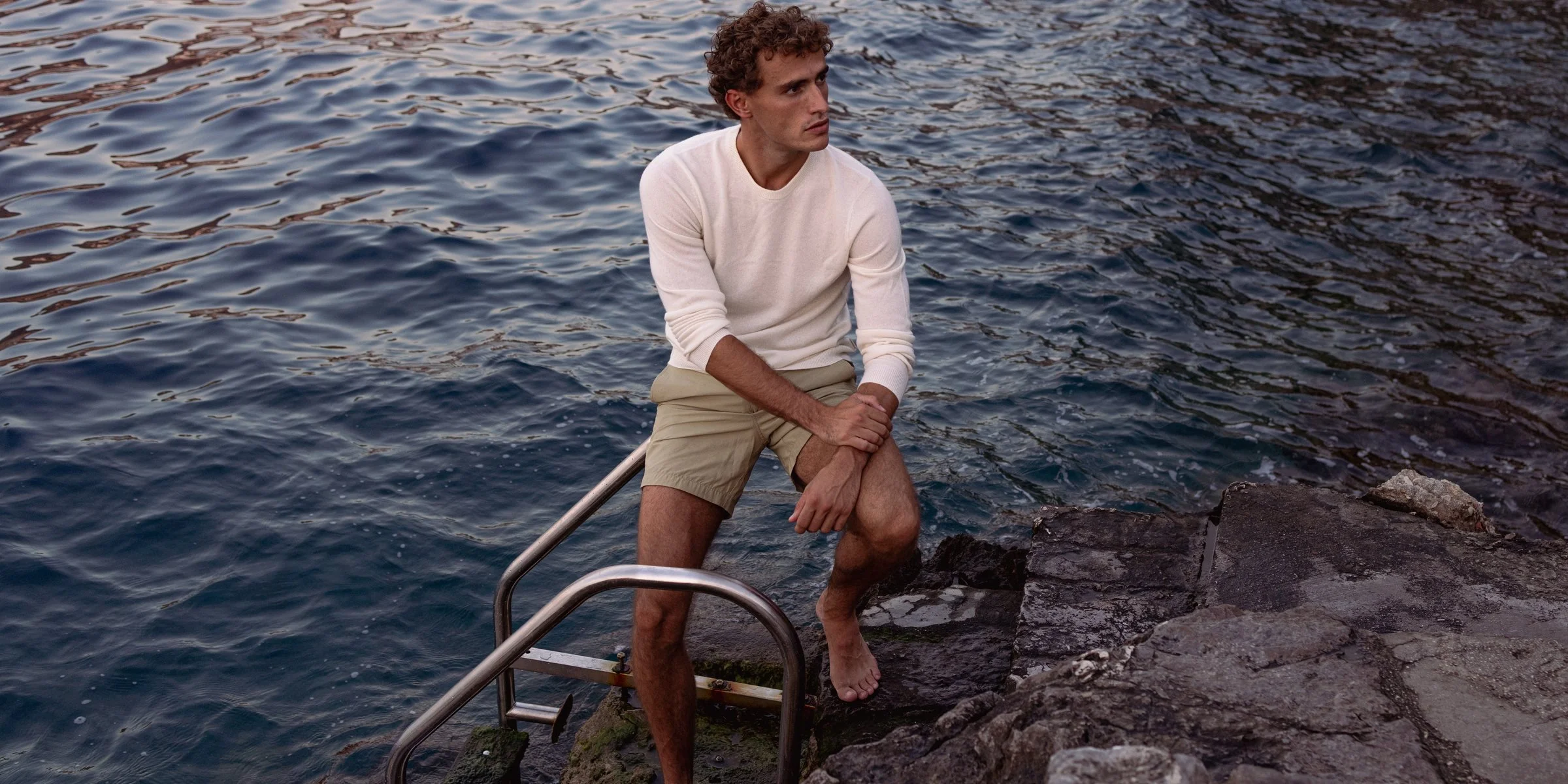 Onia Resort 2027 campaign on the rocks in Hydra, Greece