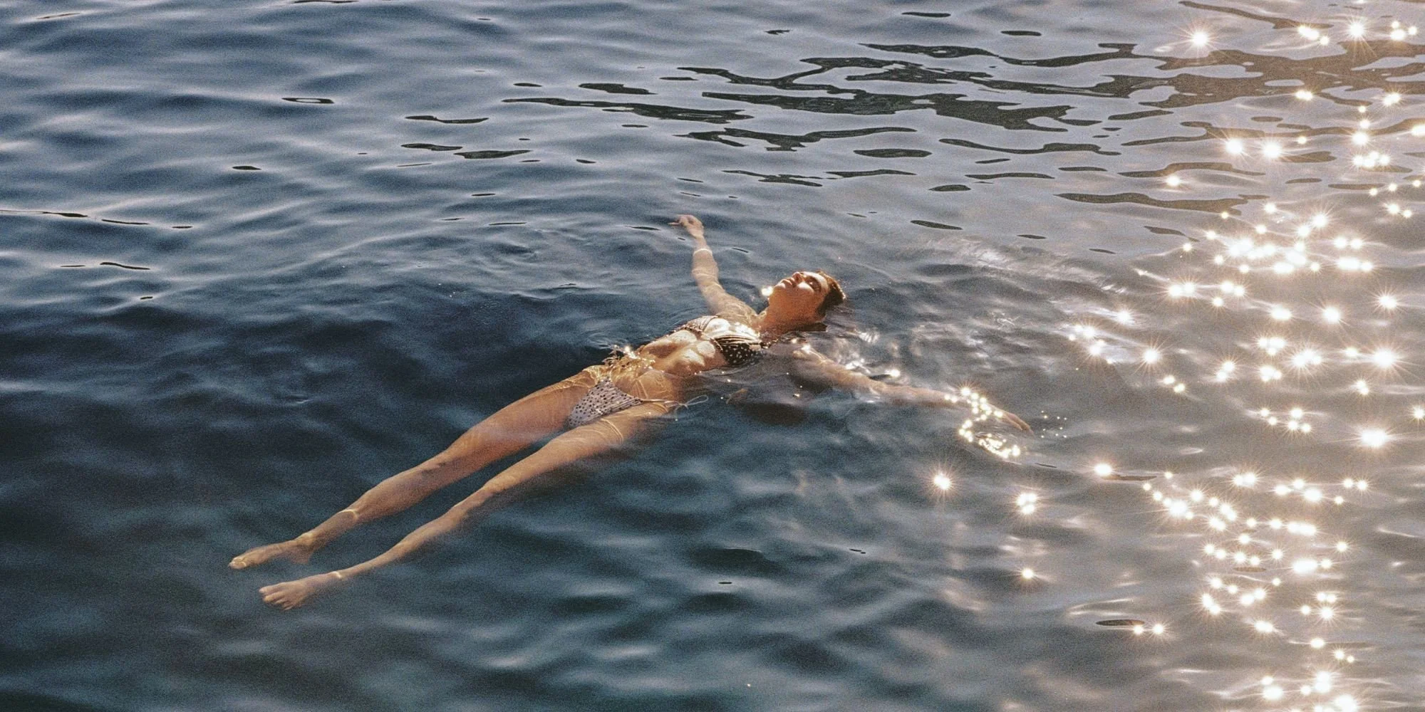 Onia Resort 2027 campaign, floating at sea