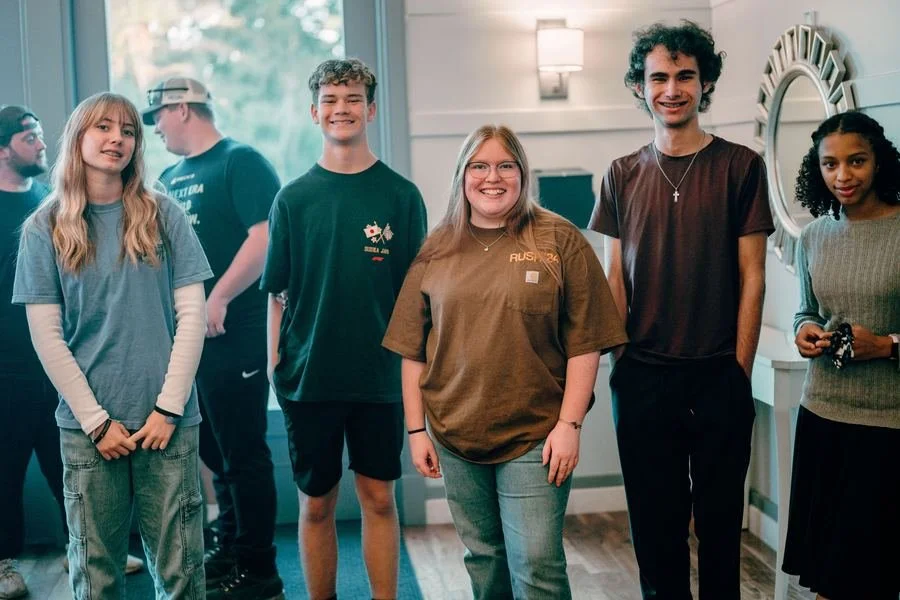 A group of Infinite Church students smiling together