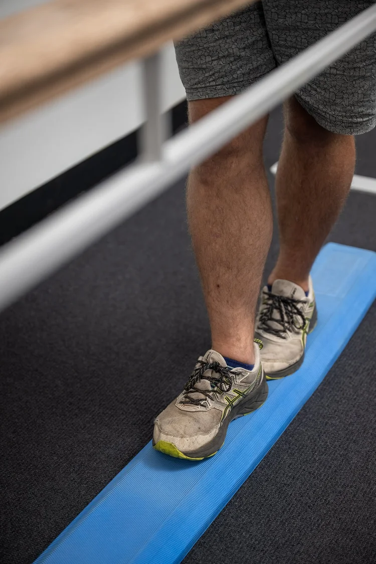 A client rebuilding balance and strength during rehab