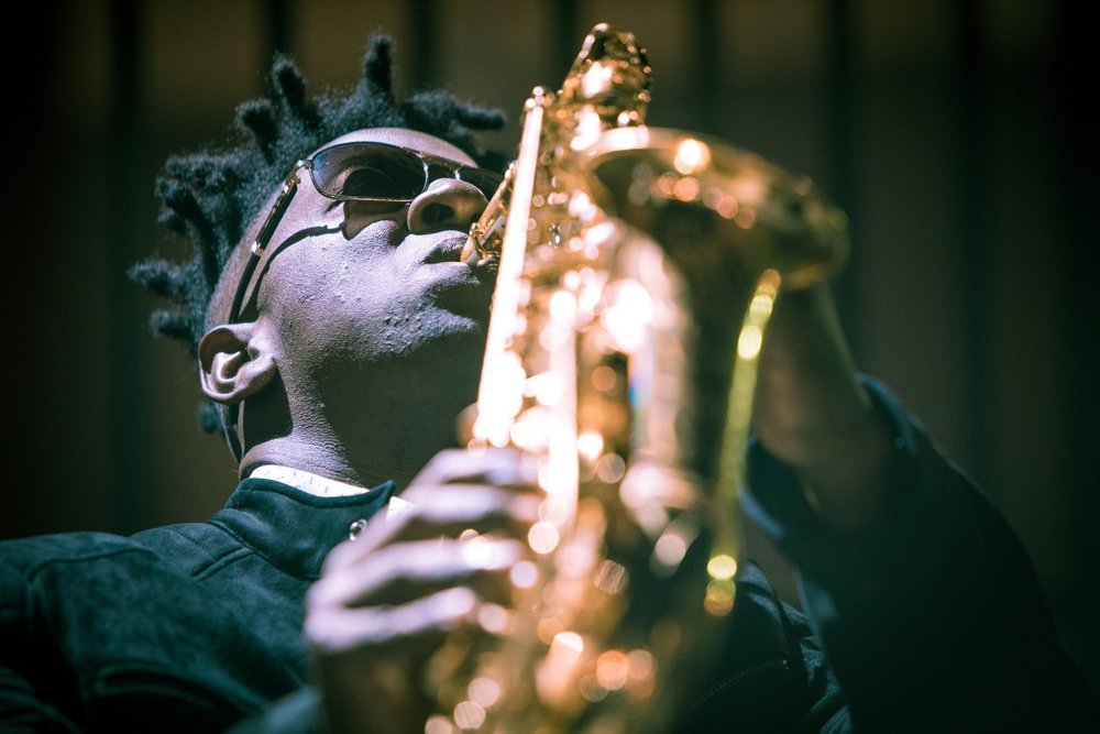 Close-up of Isaac Edwards playing his gold saxophone