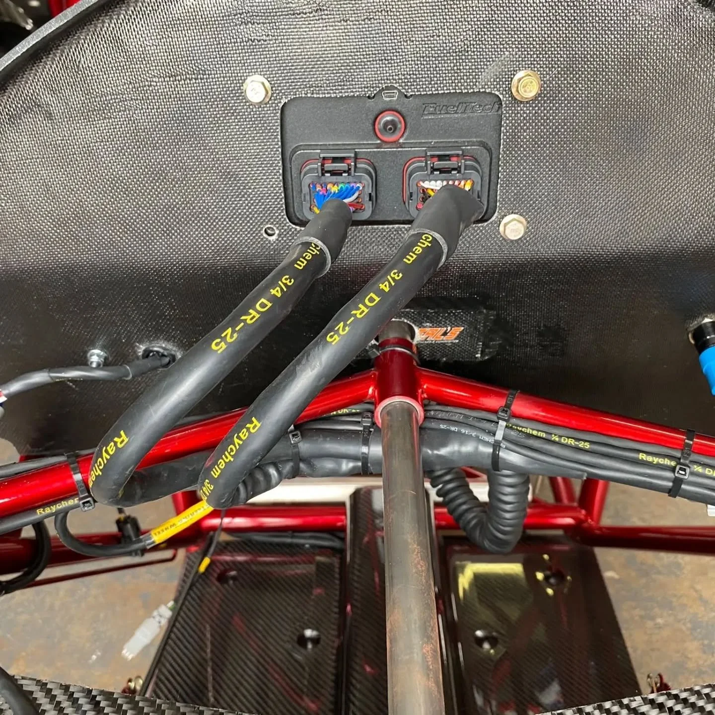 FuelTech harness branches with DR-25 covering behind the dash
