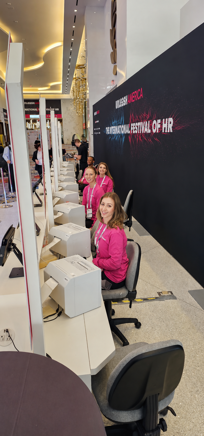Efficient Las Vegas registration event staff handling computerized credential check-in desks
