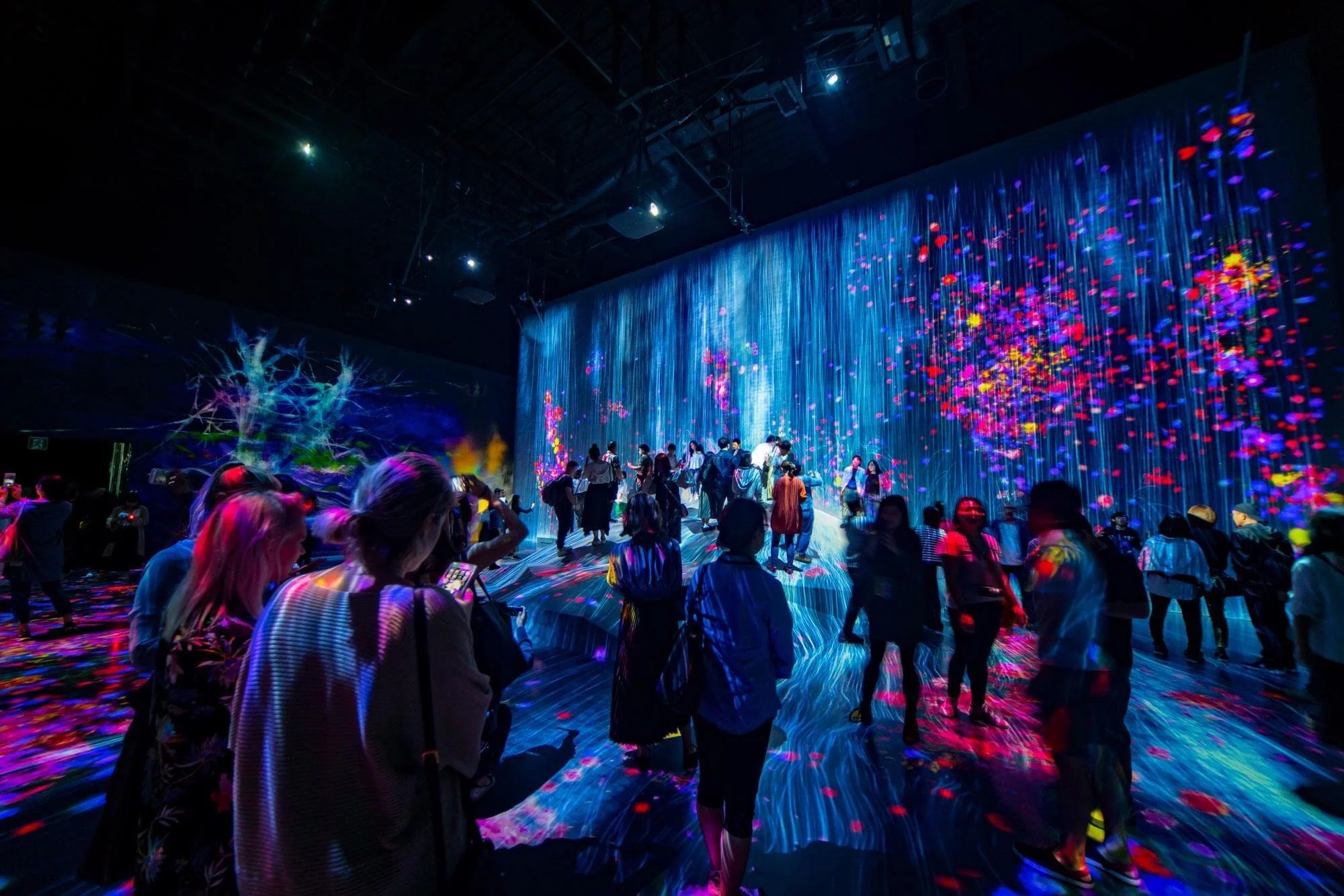 Guests surrounded by immersive light show