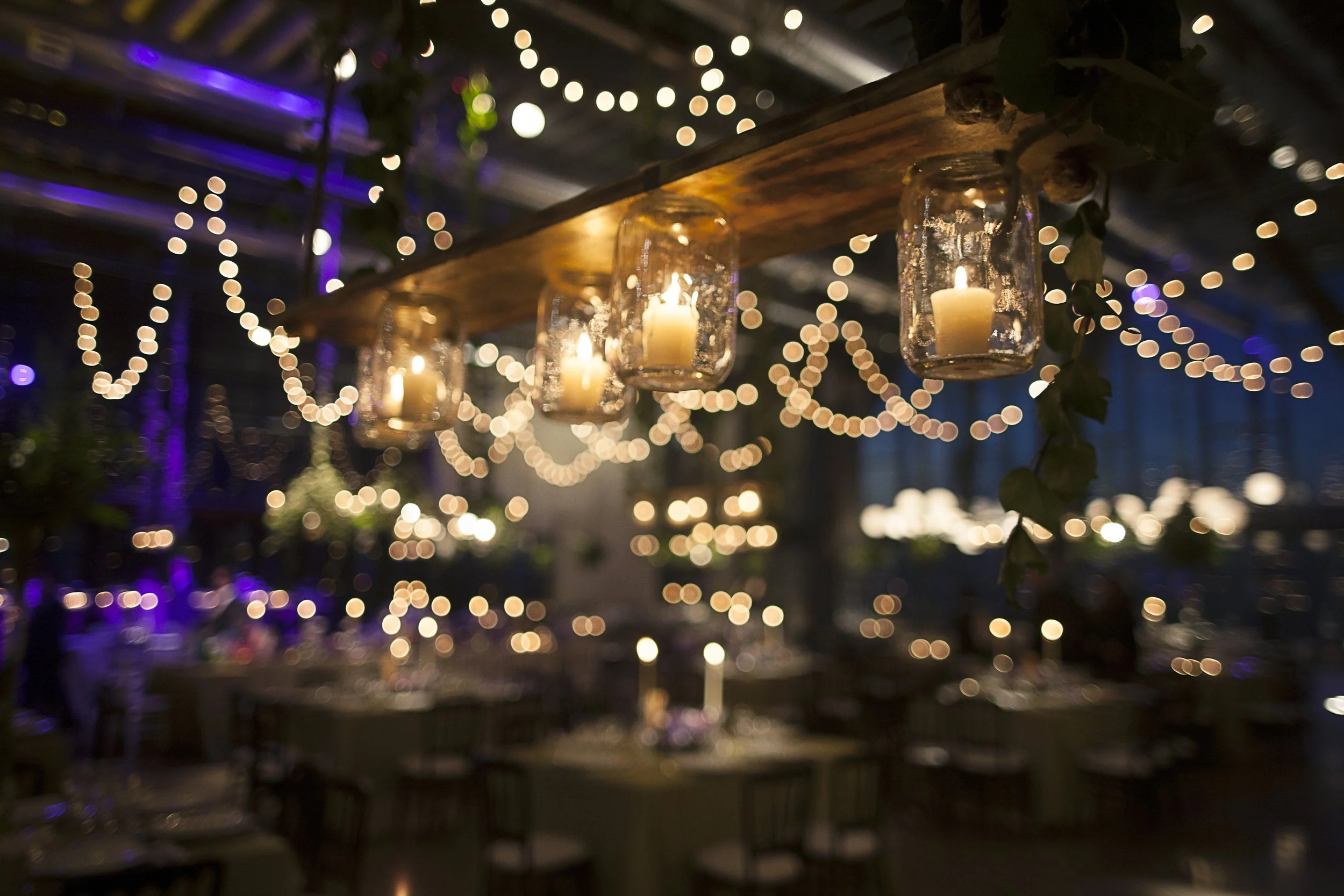 Winter wedding uplighters and fairy lights creating a warm, magical venue atmosphere in a Cheshire reception